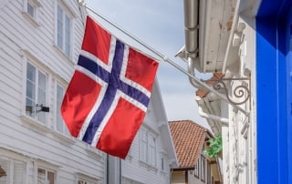 Norwegian flag flying from building